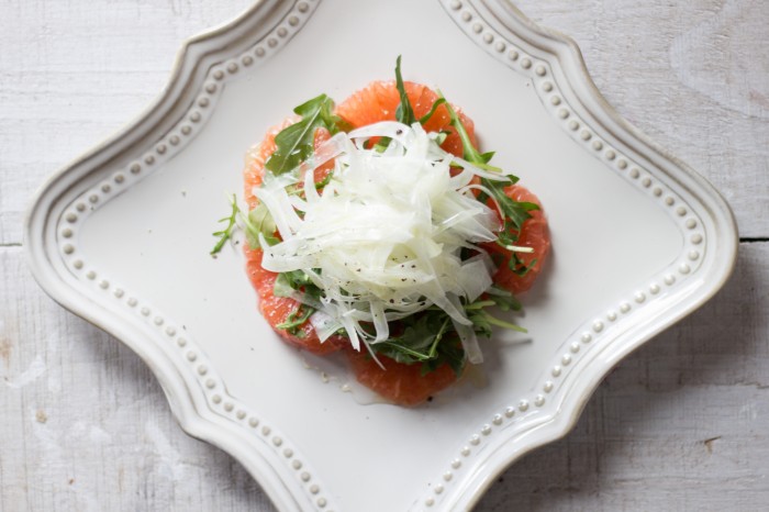 A simple salad of arugula, fennel, grapefruit dressed with honey and olive oil.