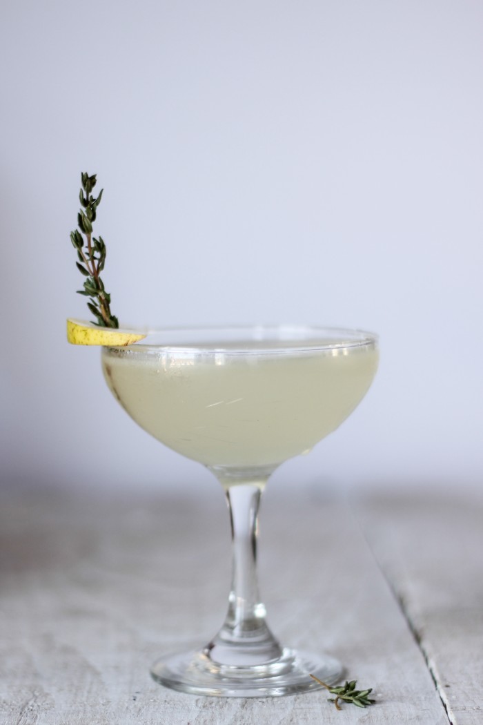 a refreshing Summery cocktail with gin, St. Germain, lemon, and pear thyme syrup