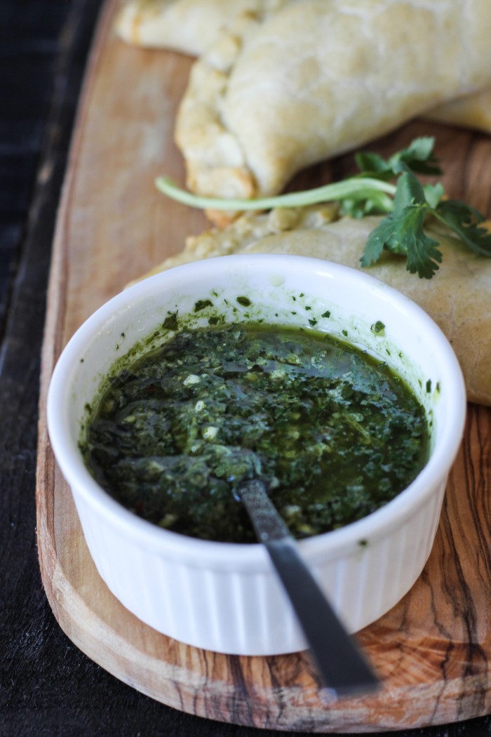 lightly spiced sweet potatoes and kale make a hearty filling for empanadas served with cilantro chimichurri