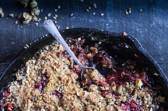 a Fall crisp with plums, vanilla and cardamom topped with crunchy rye, oats and hazelnuts