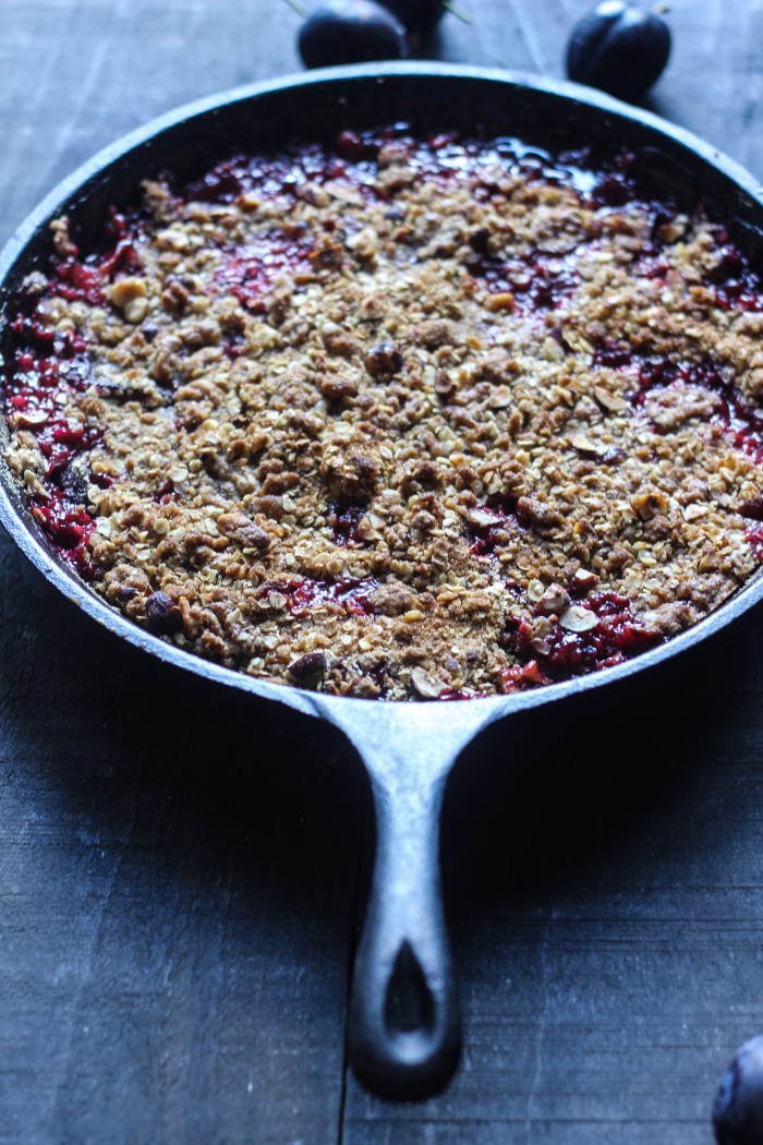 a Fall crisp with plums, vanilla and cardamom topped with crunchy rye, oats and hazelnuts 