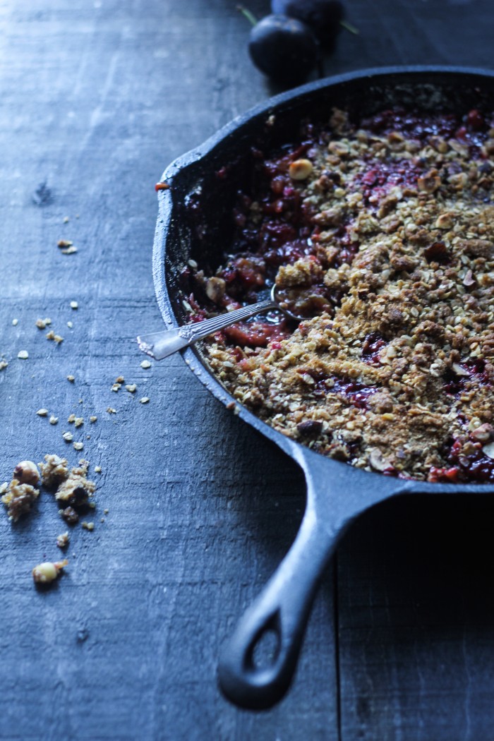 a Fall crisp with plums, vanilla and cardamom topped with crunchy rye, oats and hazelnuts 