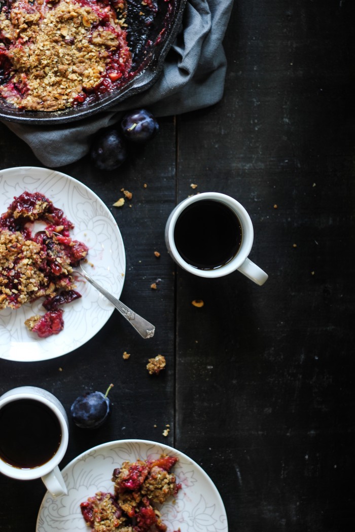 a Fall crisp with plums, vanilla and cardamom topped with crunchy rye, oats and hazelnuts